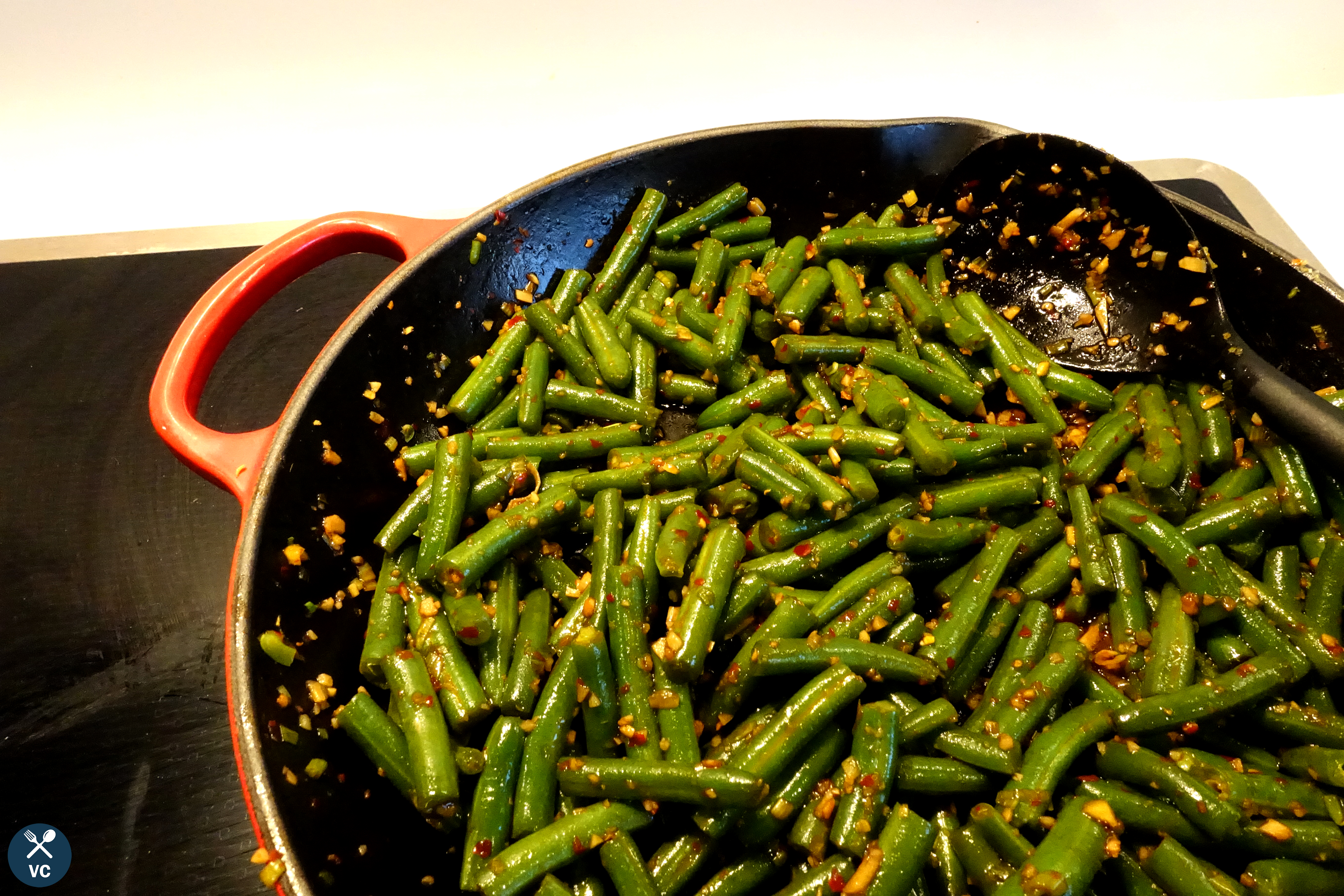 Sauteed Chinese green beans in a pan (VC in the Kitchen)