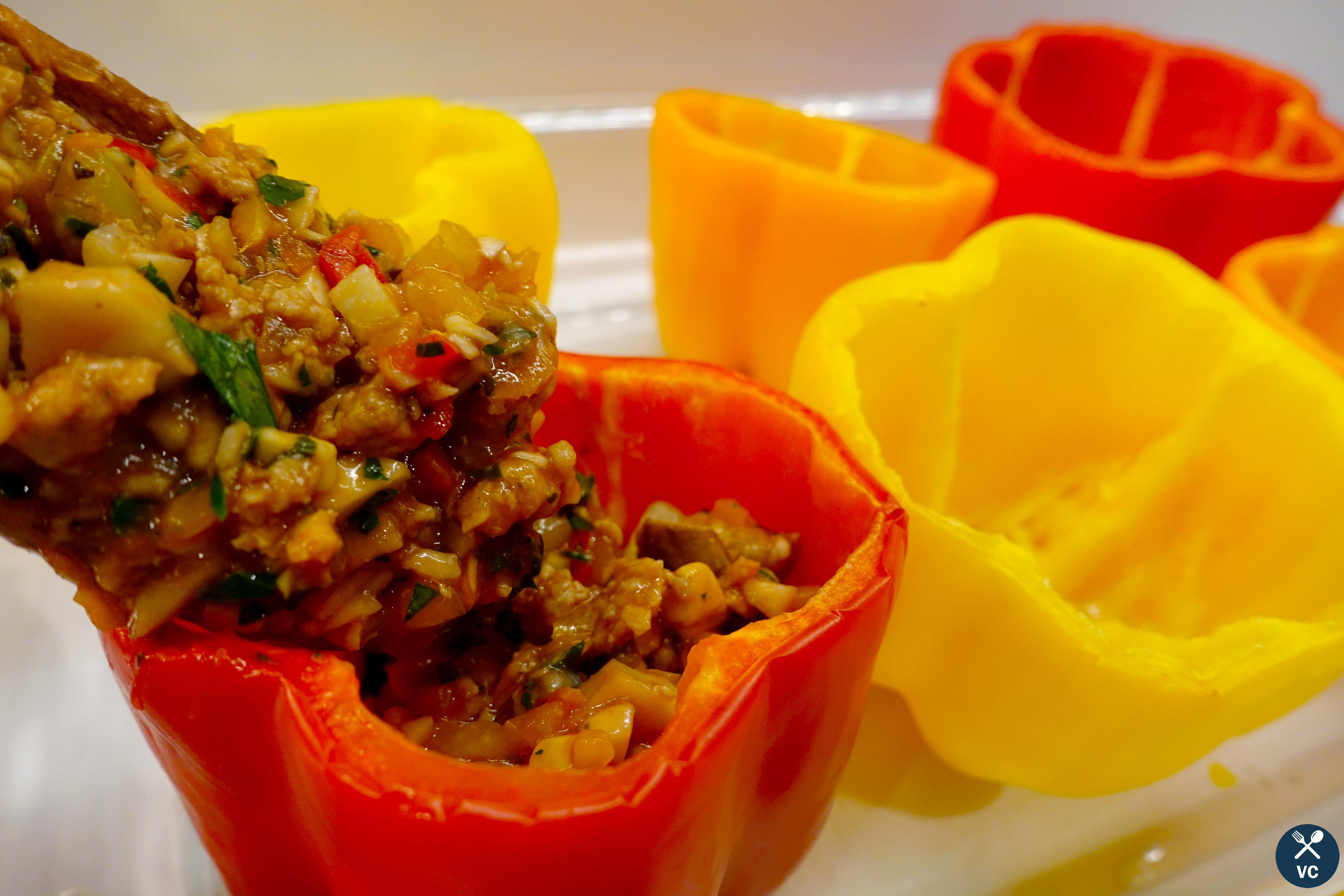 Filling the turkey stuffed bell peppers with turkey and veggies (VC in the Kitchen)