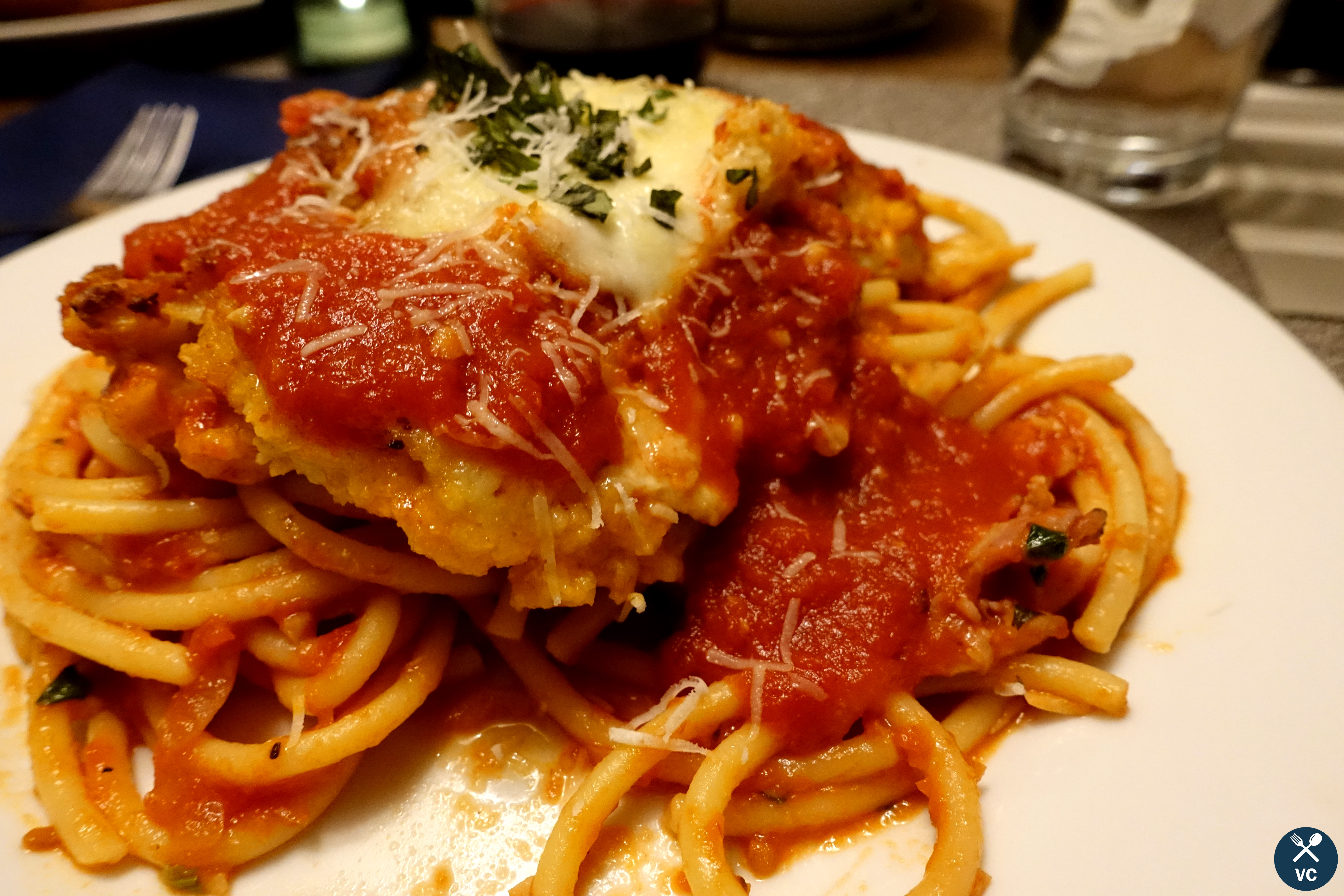 Chicken parmesan served over a bed of bucatini (VC in the Kitchen)