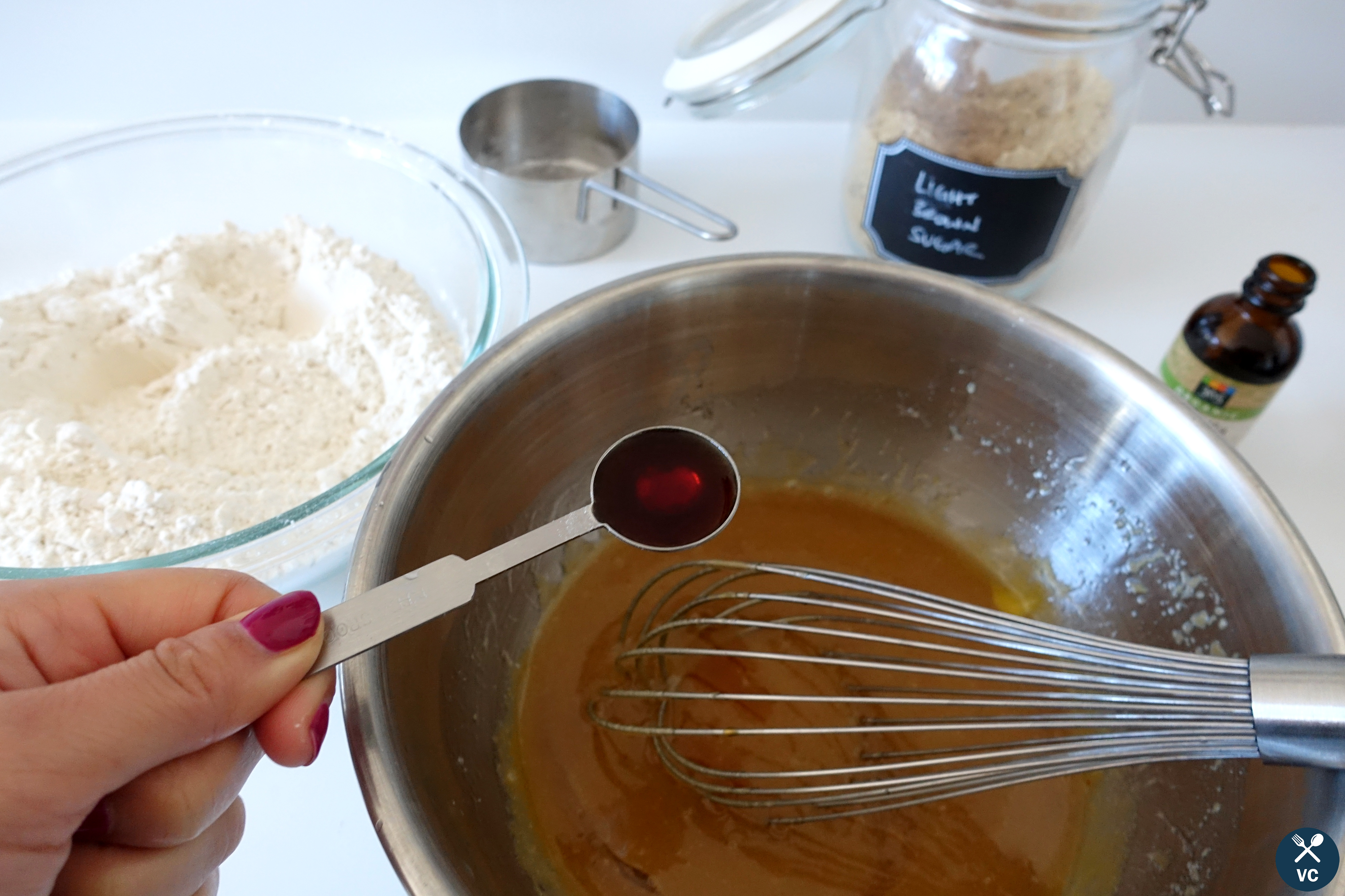 Adding in vanilla extract for Sea Salt Rolo Stuffed Cookies (VC in the Kitchen)