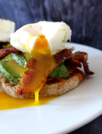 Oozing egg yolk of an open-faced breakfast sandwich (VC in the Kitchen)