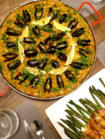 Paella mixta (paella with seafood and meat) on the dinner table (VC in the Kitchen)